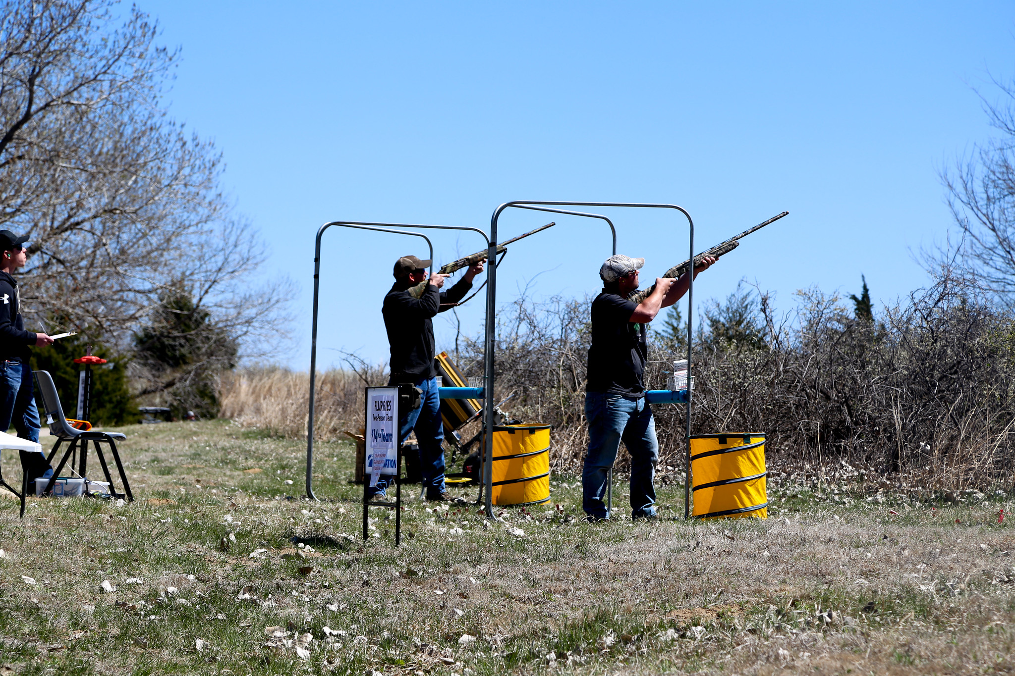 Clayshootmedia – Participants in the 2019 clay shoot take aim at flying sporting clays down range. The 12-station event also features a side game of flurries, which offers participants an opportunity to practice or compete amongst themselves for bragging rights.