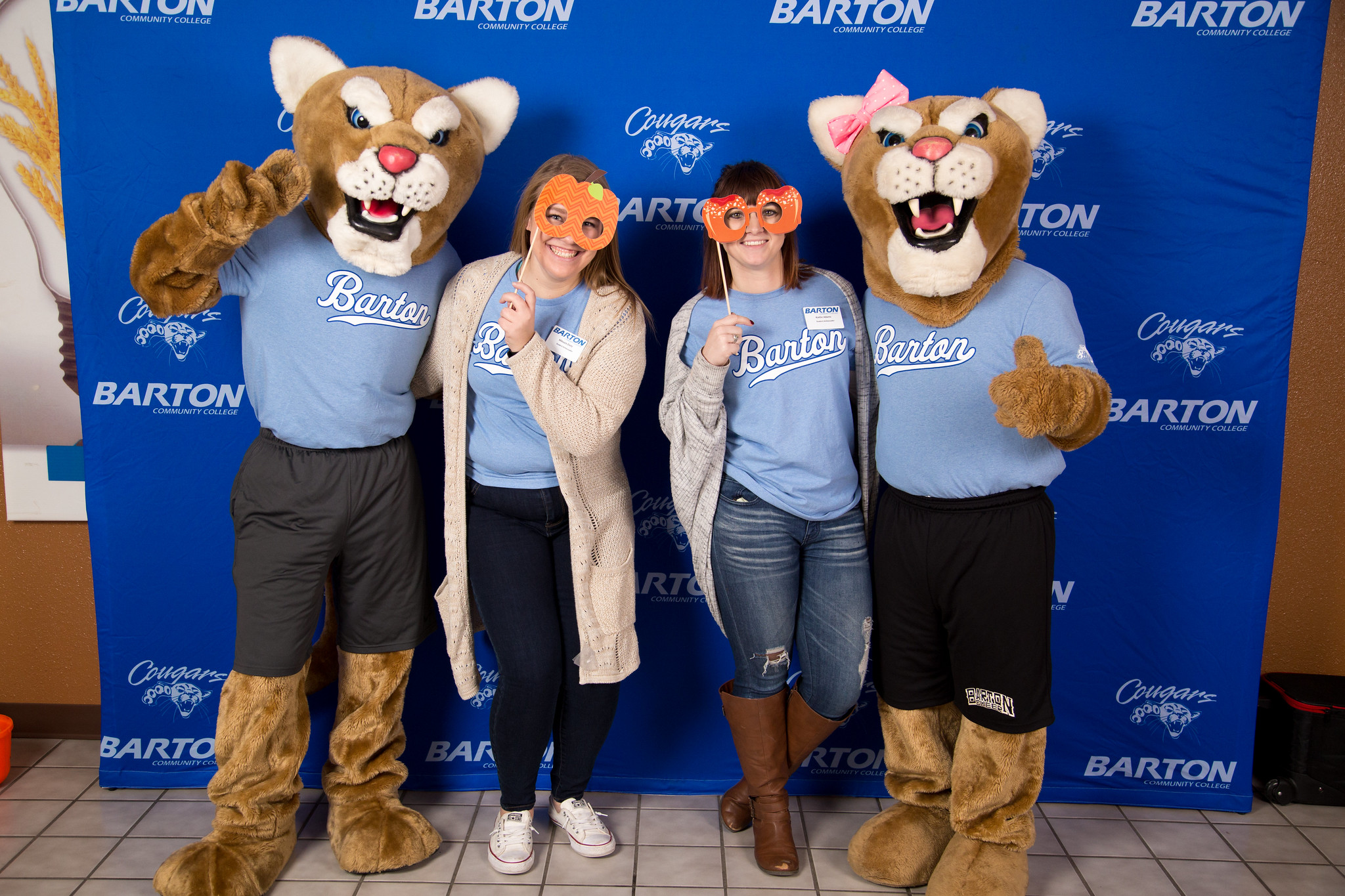 Mascots posing with students