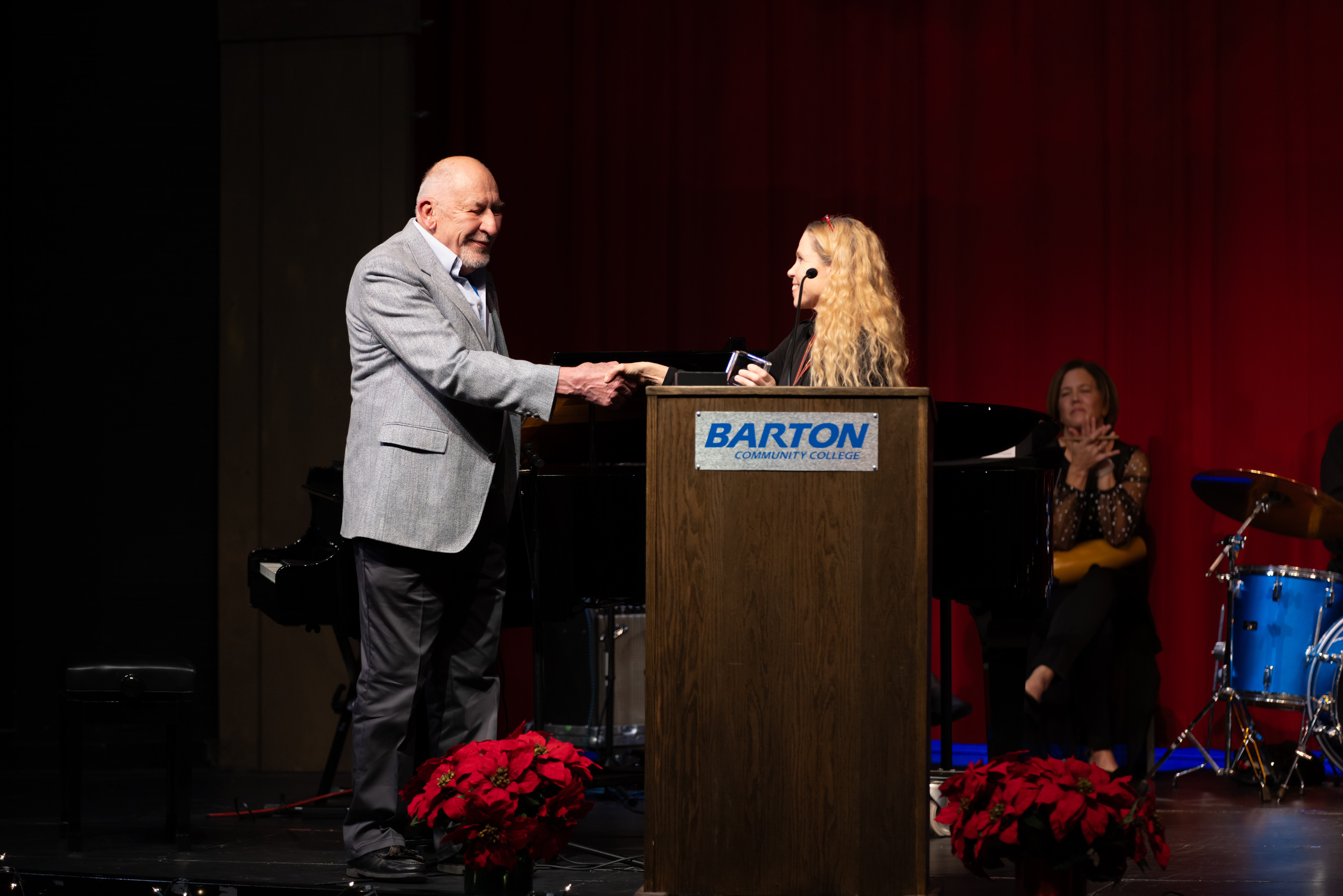 Bielek (right) presents the Hall of Fame award to Bob Loss (left). As the Director of Theatre, Loss brought theatrical productions to life at Barton for 20 years. 