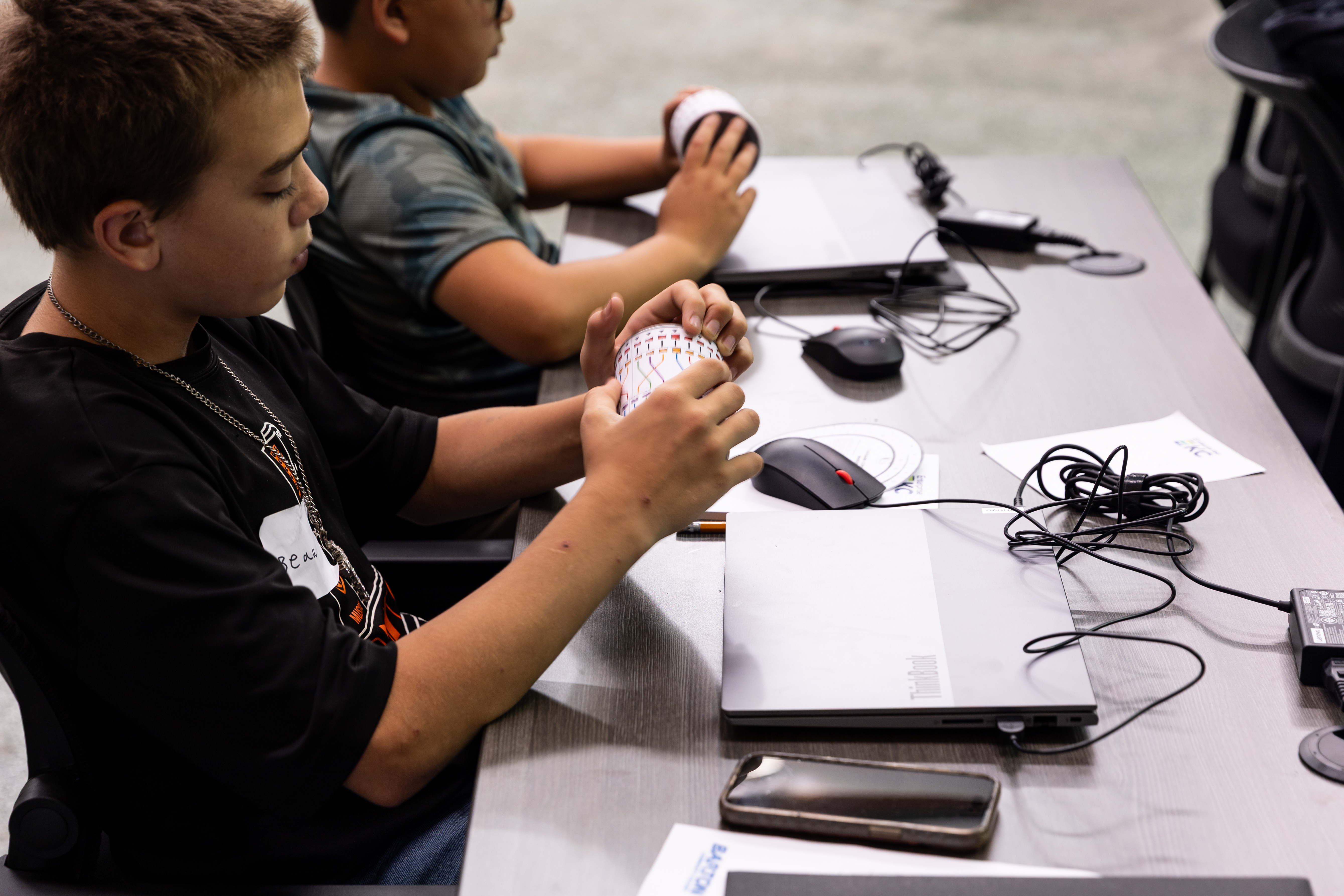 Students take part in hands-on activities during the Cyber Summer Camp hosted by Barton Community College, SOFTwarfare, and Enterprise KC.