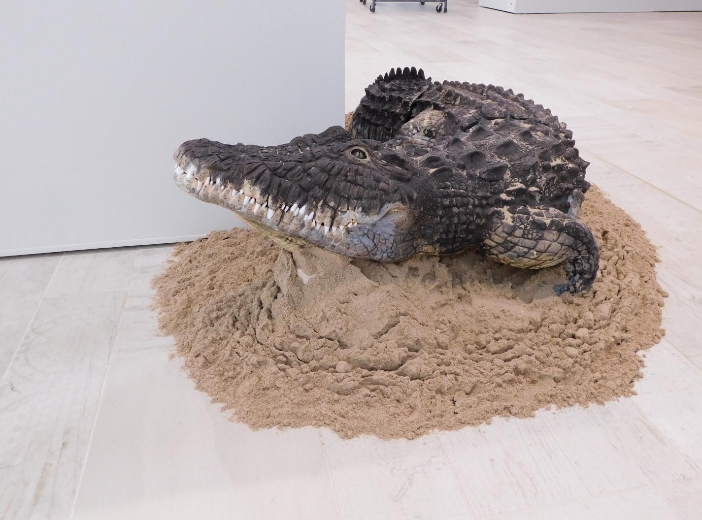 ceramic detailed sculpture of an alligator
