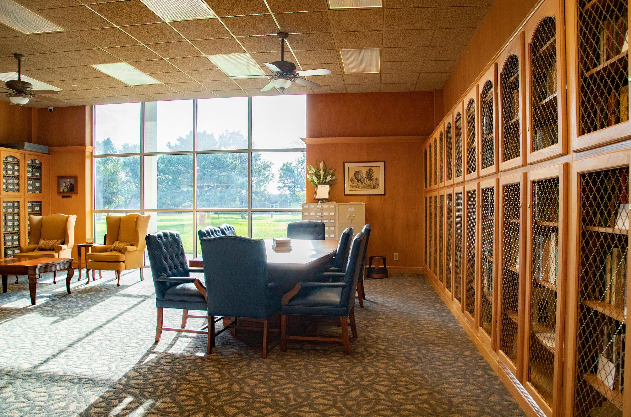 conference table and chairs and books in the cohen center