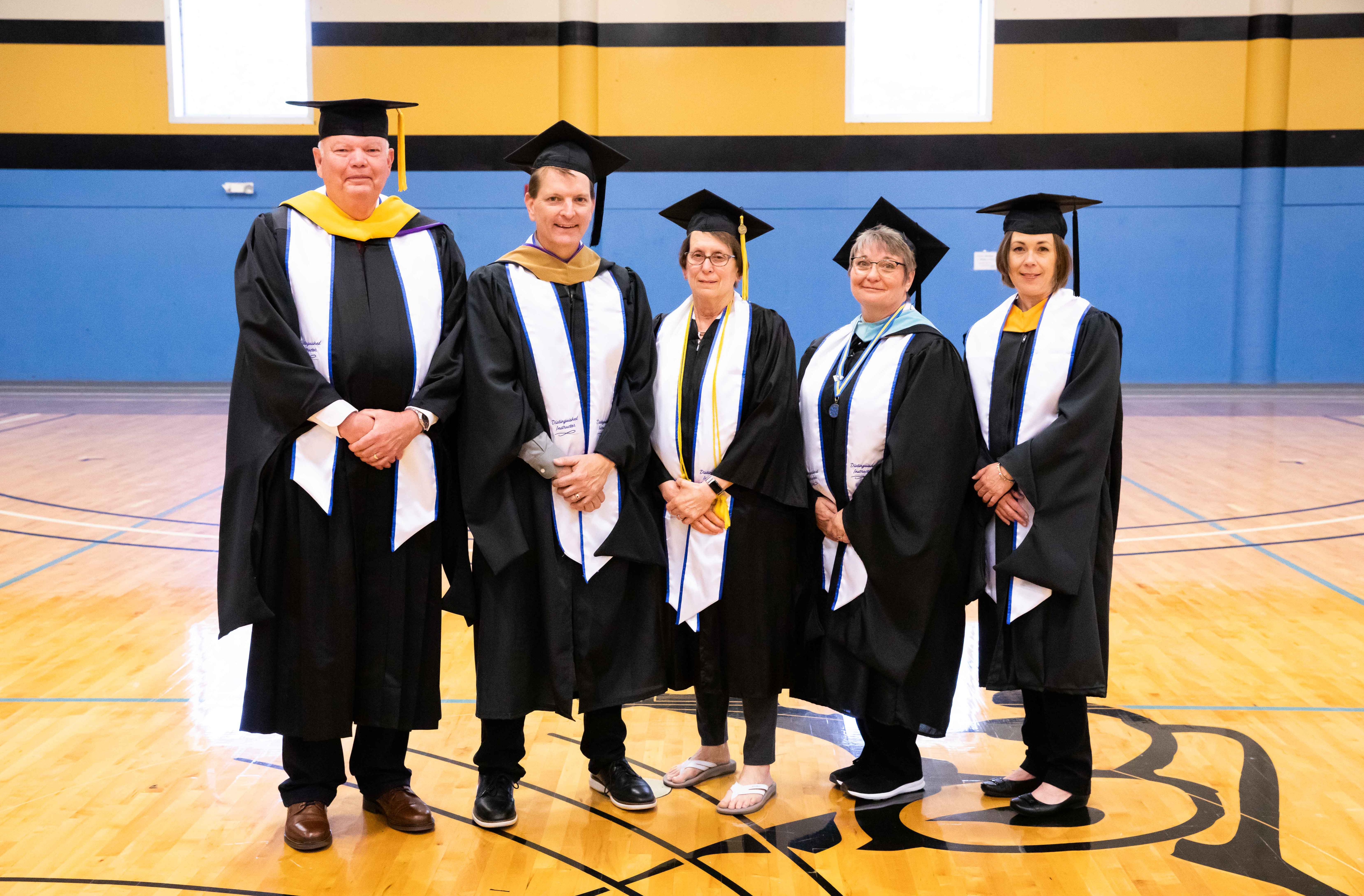 faculty pose for a photo