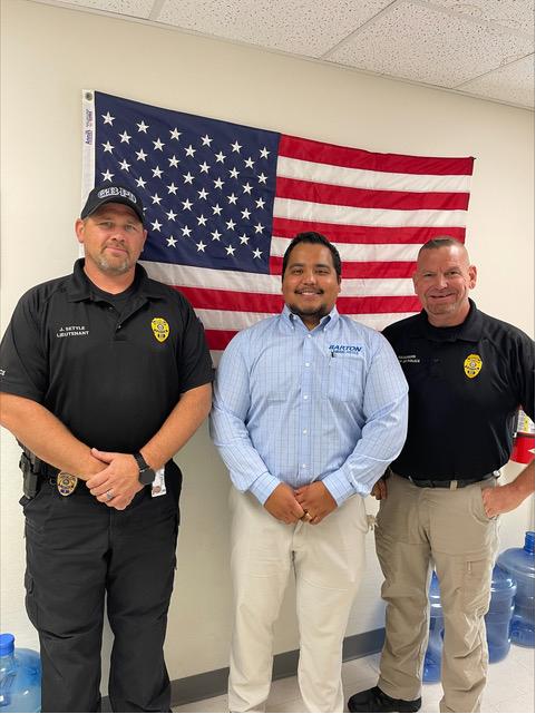 Barton criminal justice instructor and coordinator poses with Great Bend Police Department 