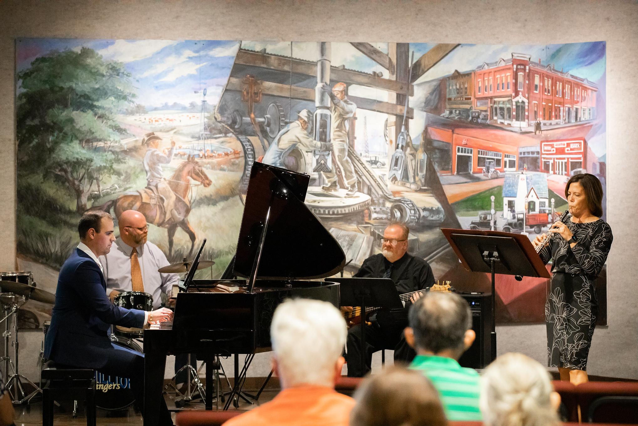 musicians playing in an art gallery