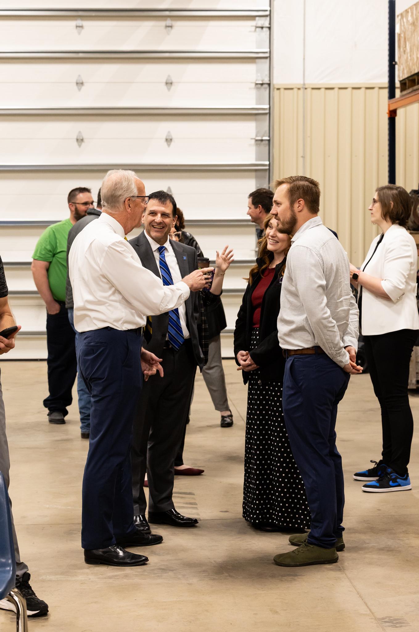 people talking with a senator