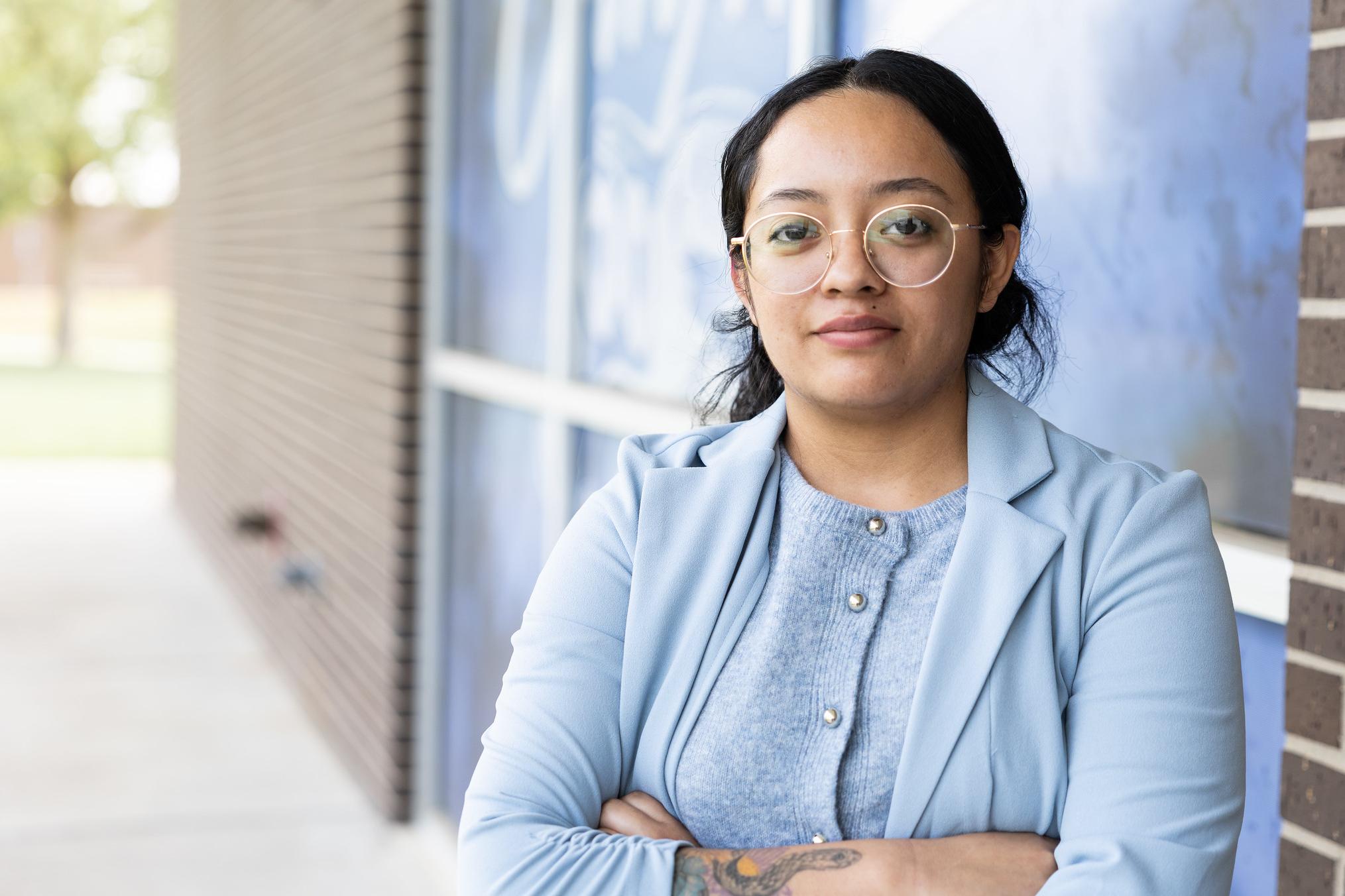 women posing for photo in business suit with glasses