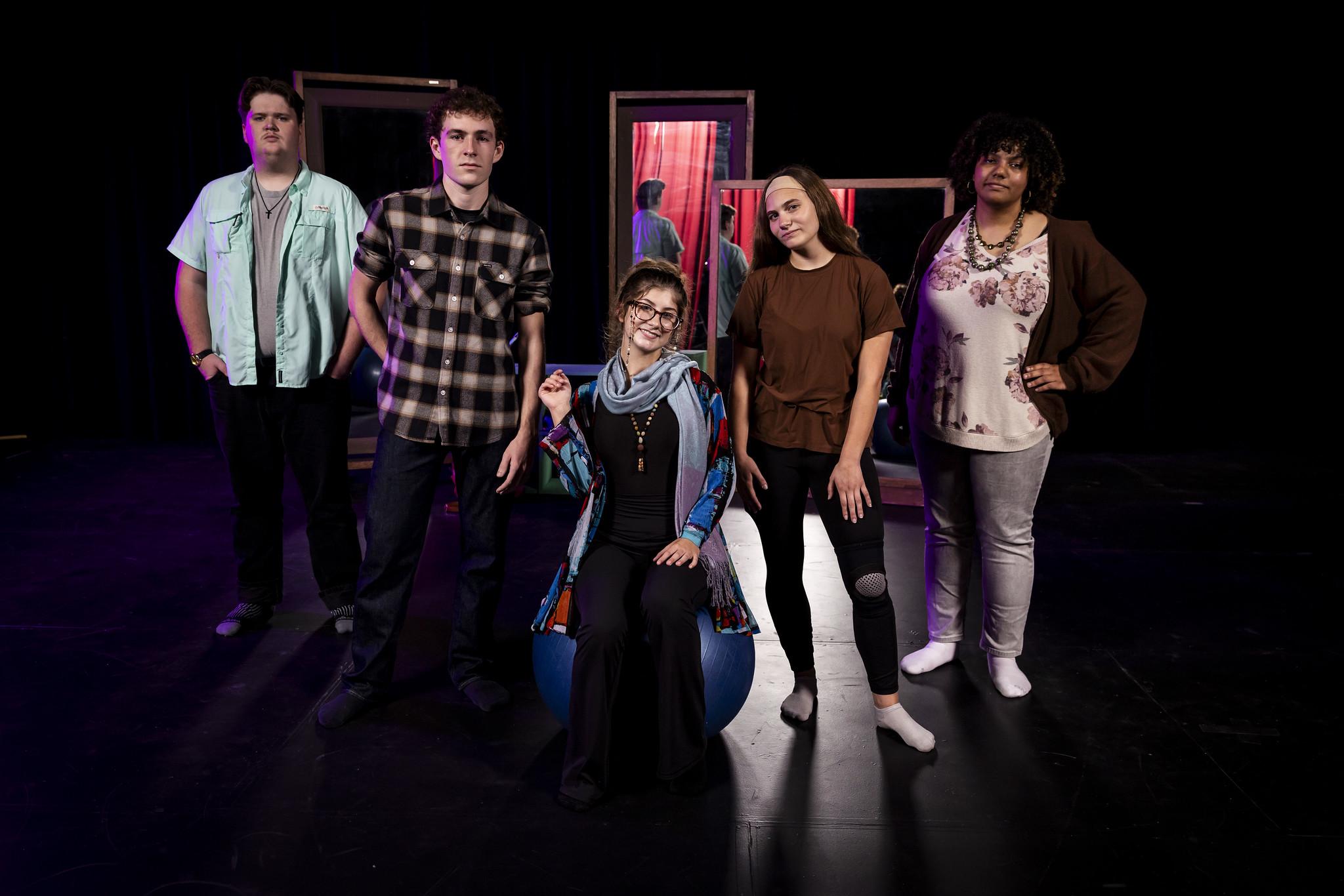 actors on a stage posing for photo