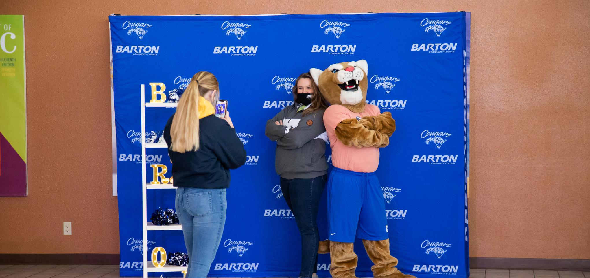 Bart takes a photo with a student
