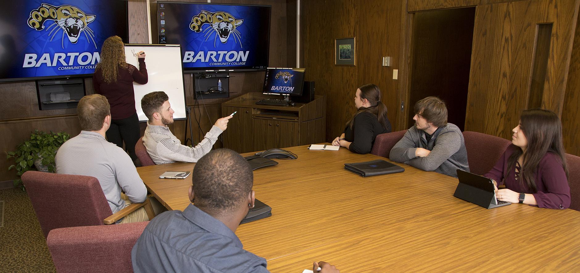 business students meeting in conference room