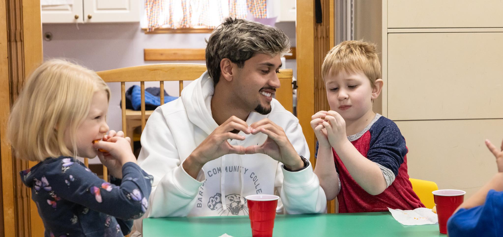 Barton student pretend play at table