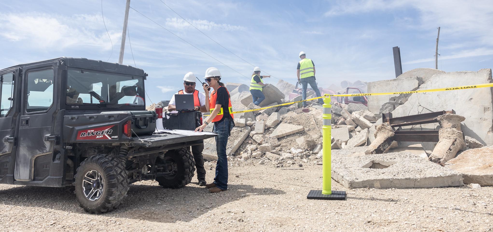 emergency management personnel assess crisis situation