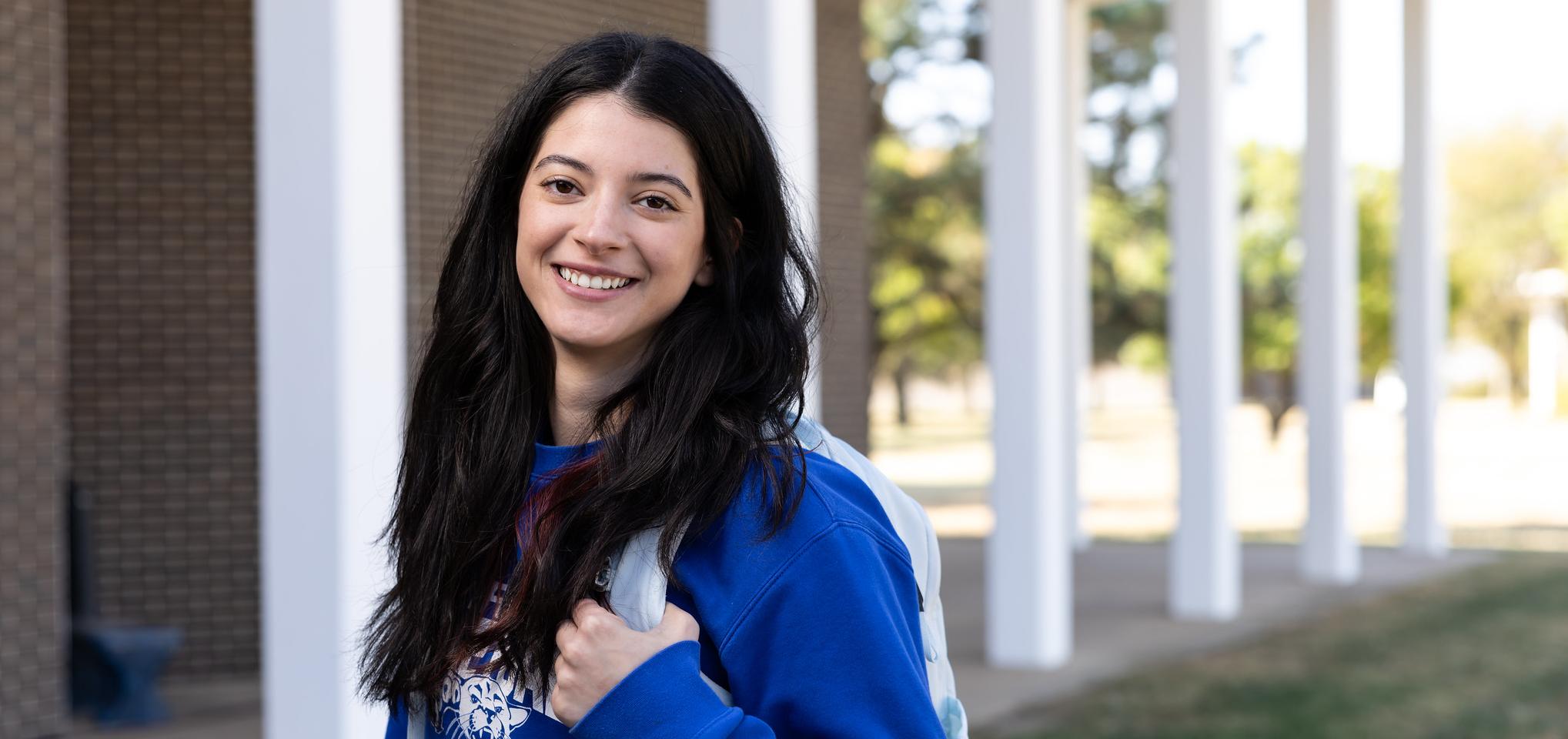 Barton student with backpack on campus