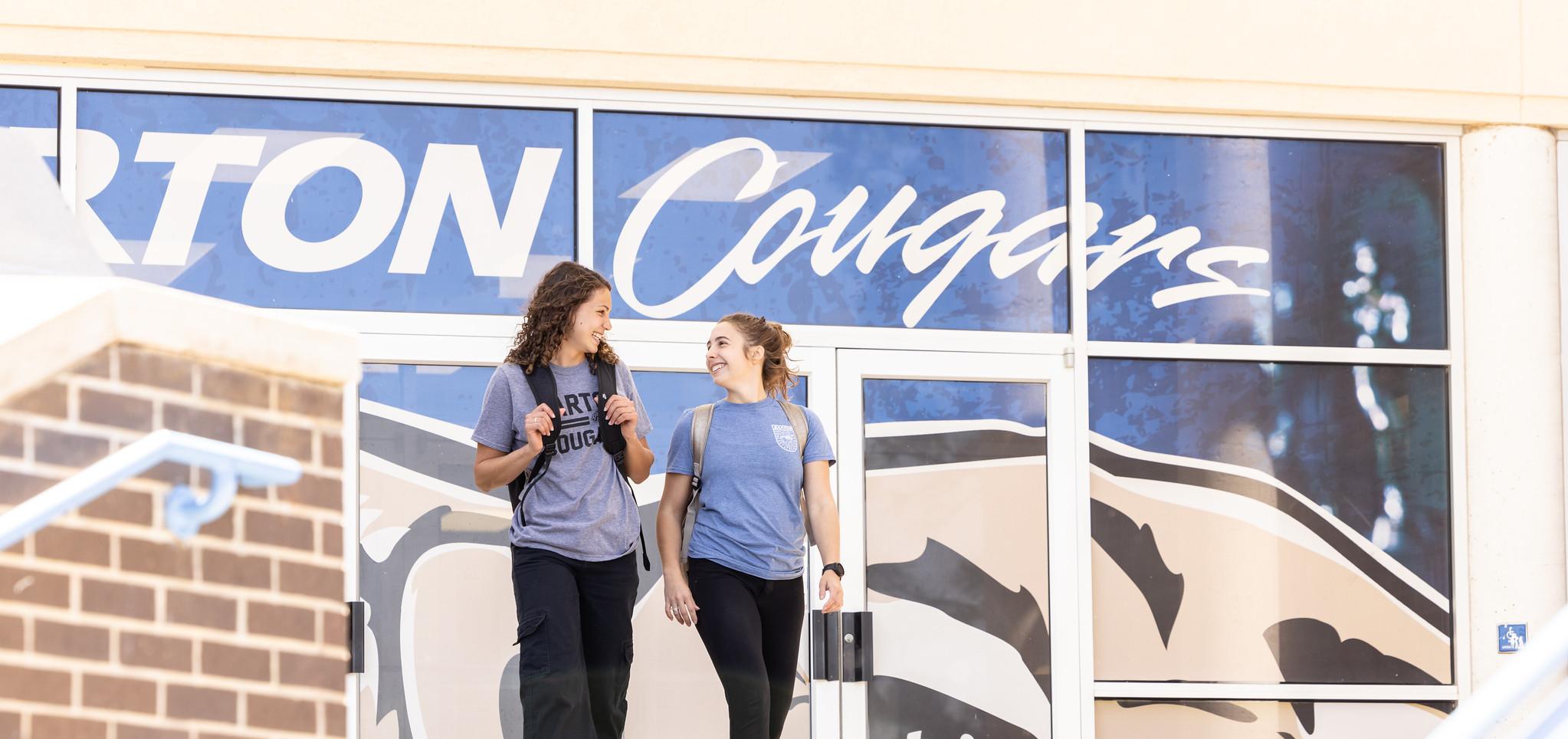 Students walk on campus outside the Kirkman Center