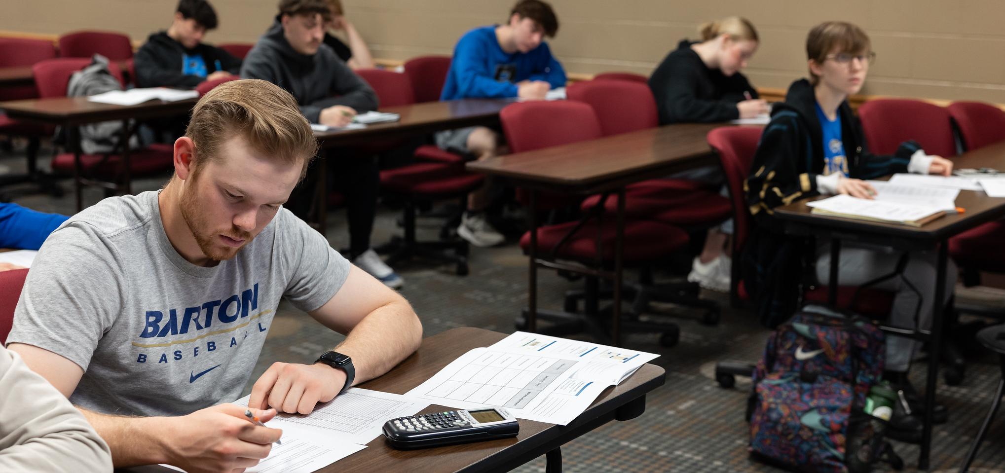 Student works on homework in accounting classroom