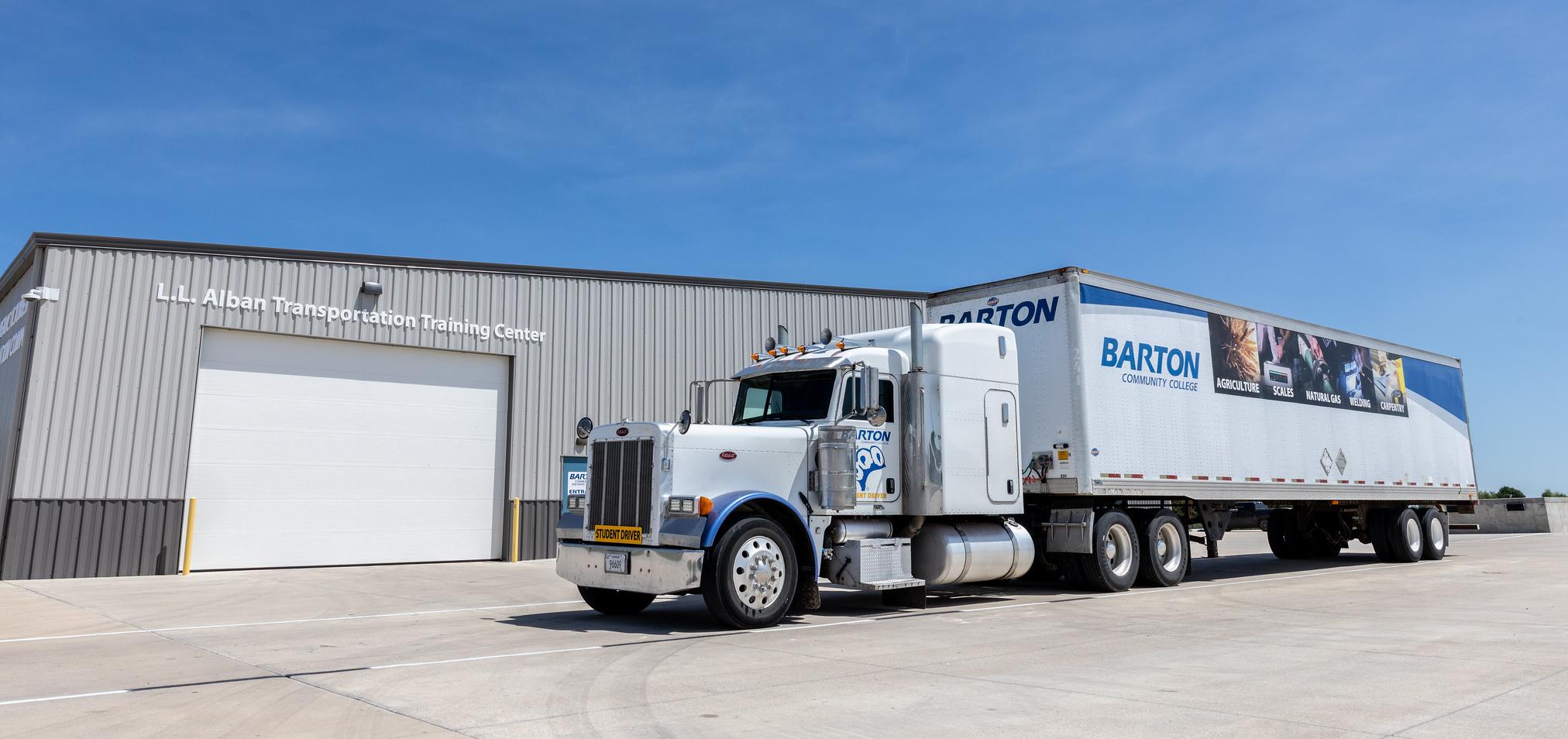 Barton's semi truck sits in front of the Ag Complex