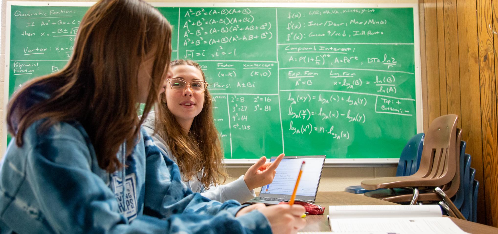 Math students work on homework together