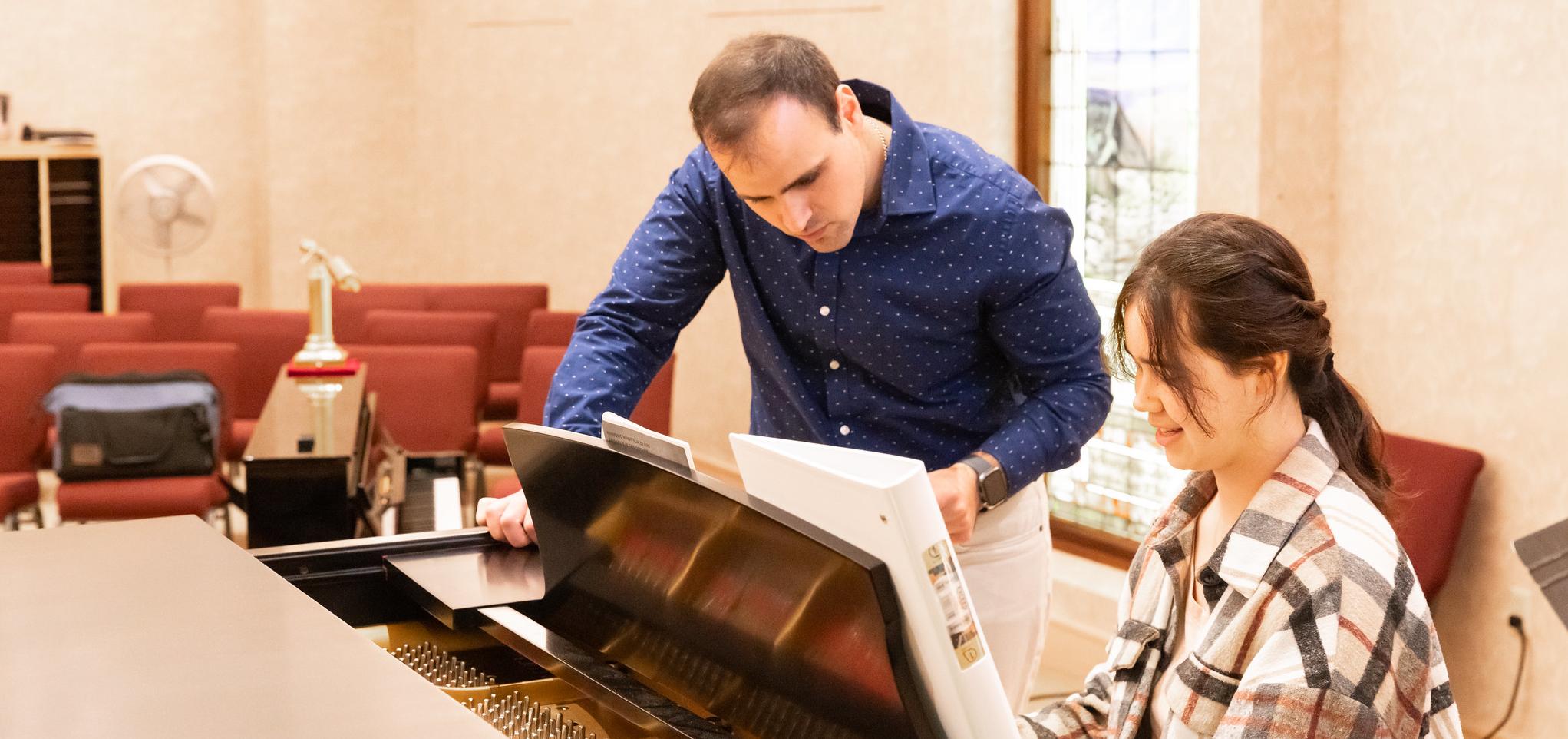 Barton music instructor works with piano student