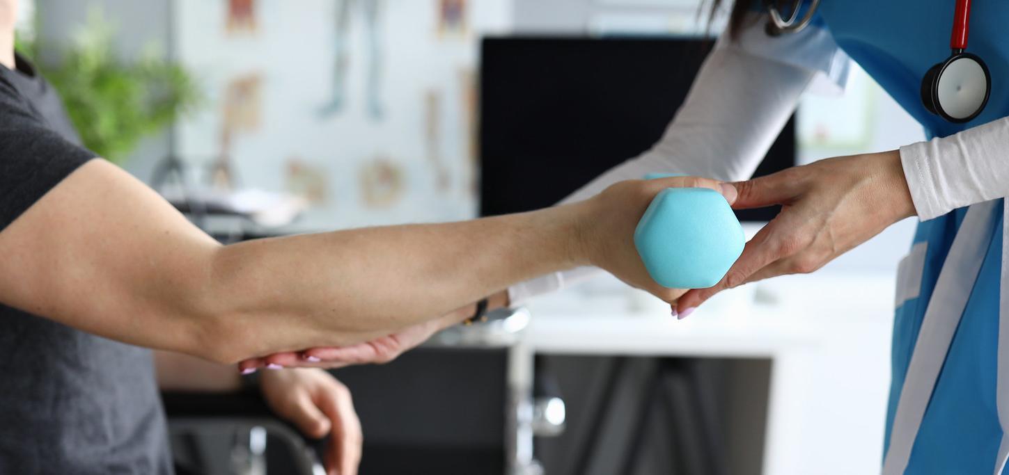 Occupational therapist works with patient