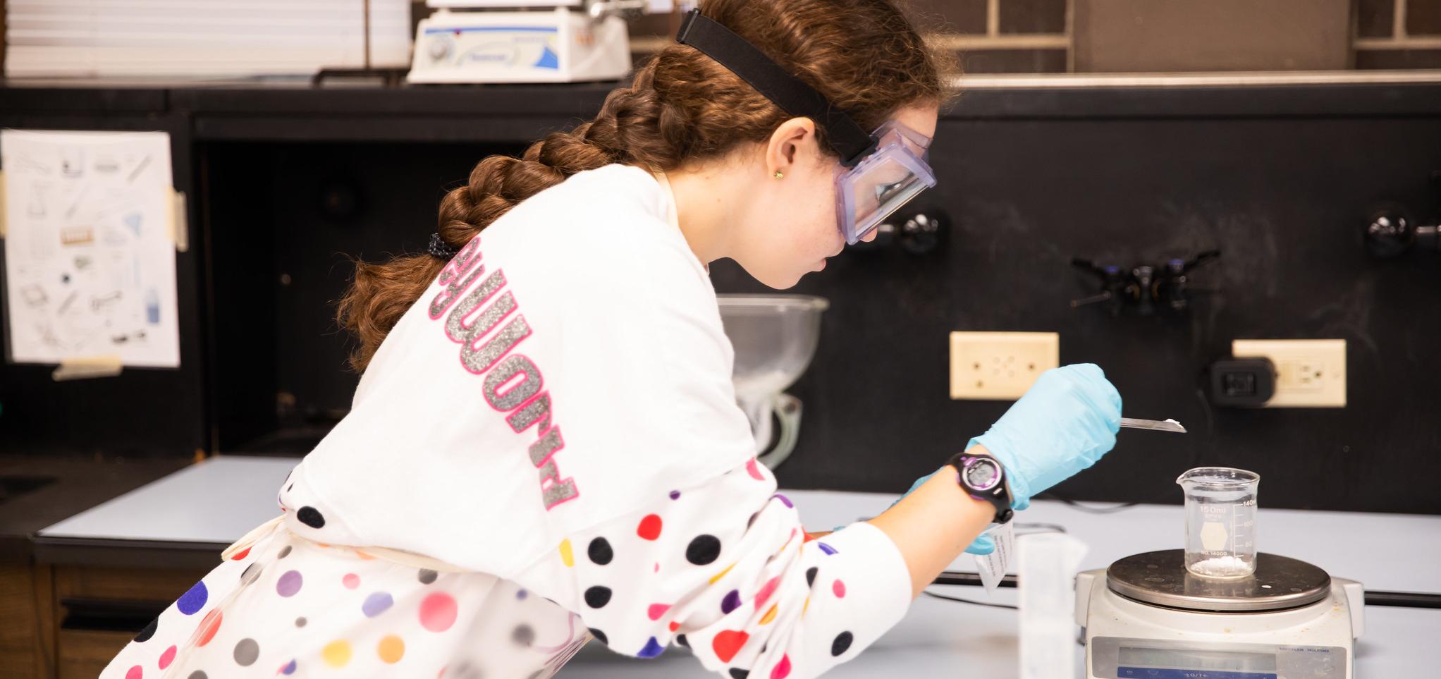Student conducts experiment in barton classroom