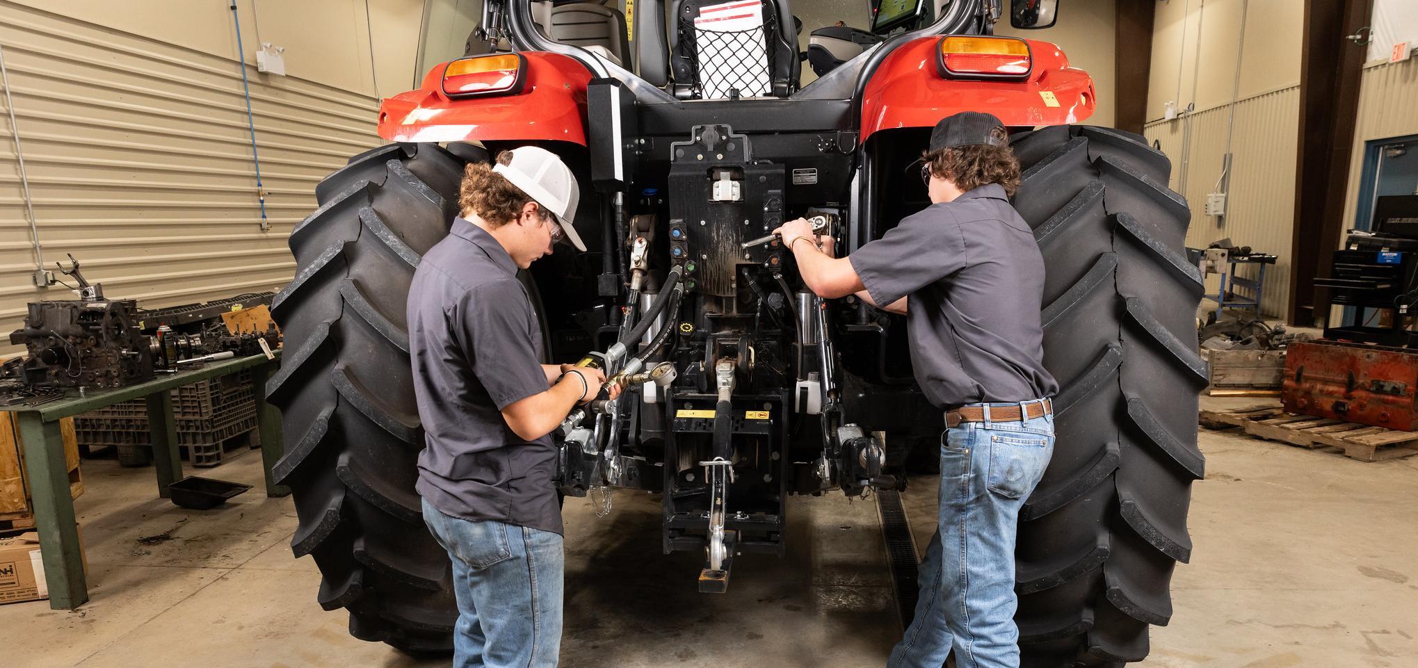 Students work on tractor in Barton Ag class