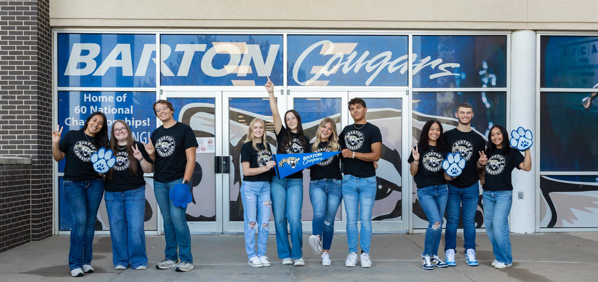 2025 student ambassadors in front of Kirkman windows