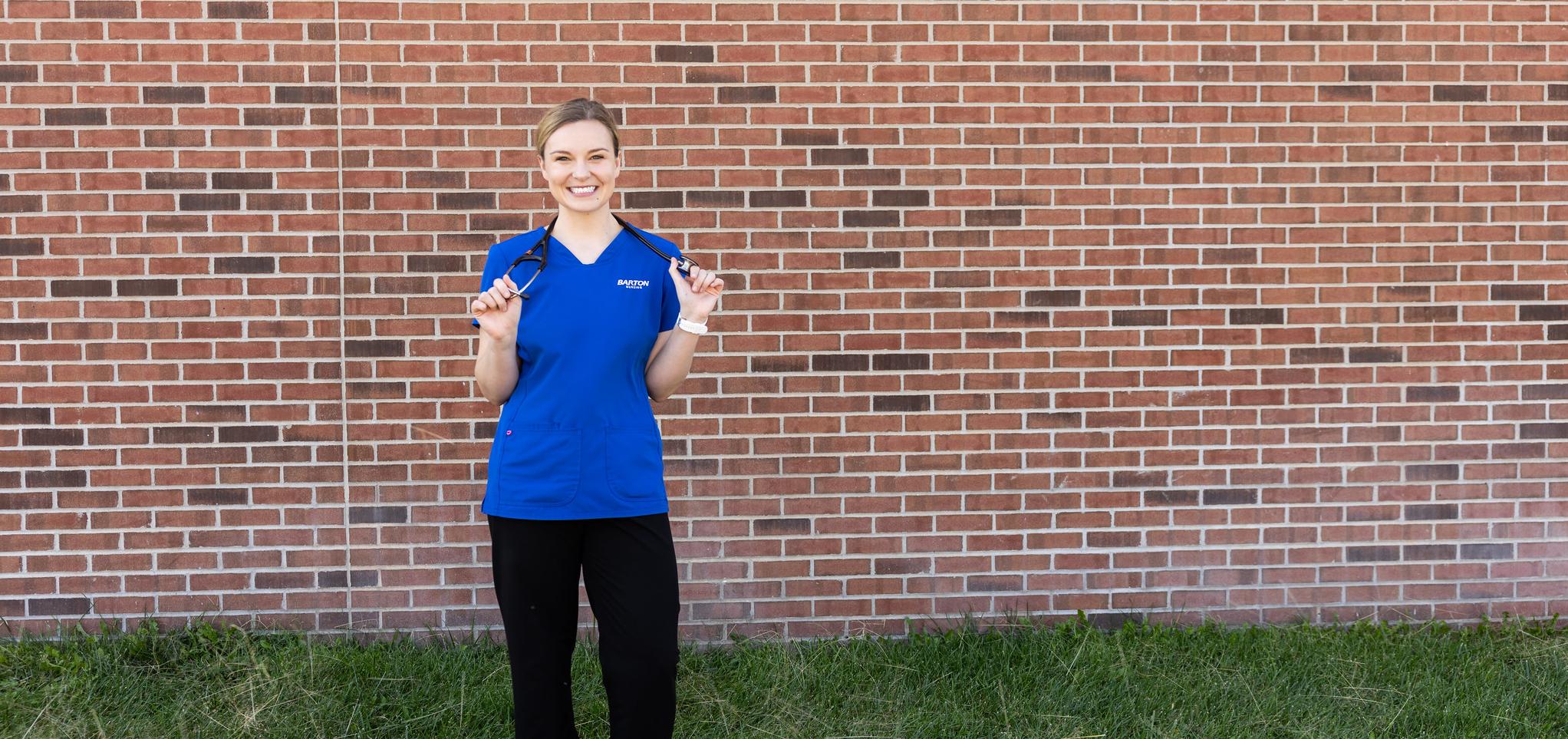 Barton nursing student smiles with stethoscope 