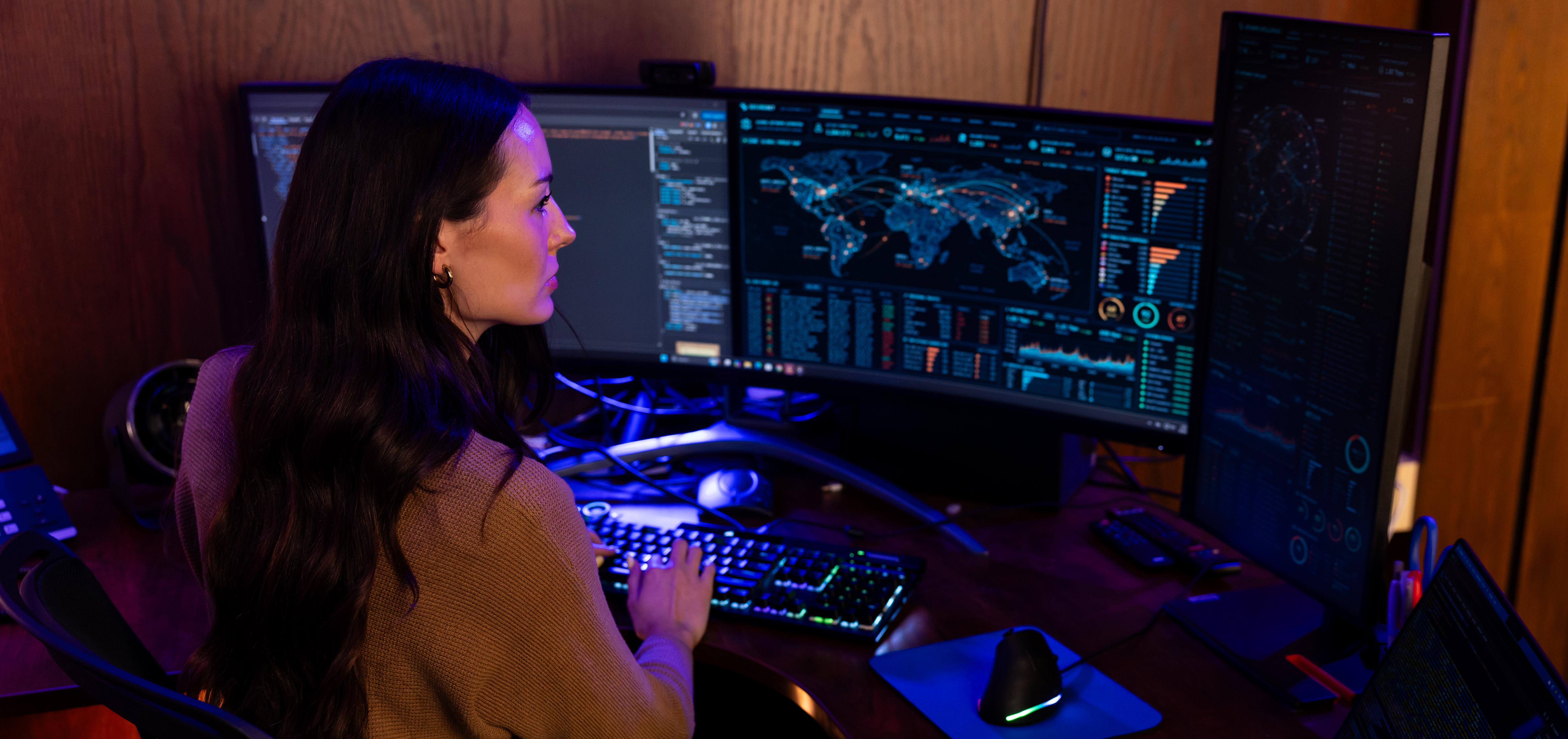 Network Specialists work on computer screens